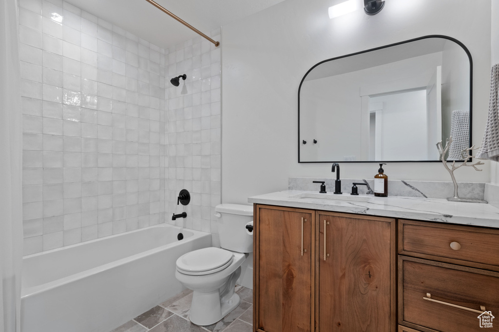 Full bath with toilet, shower / bath combination, and vanity