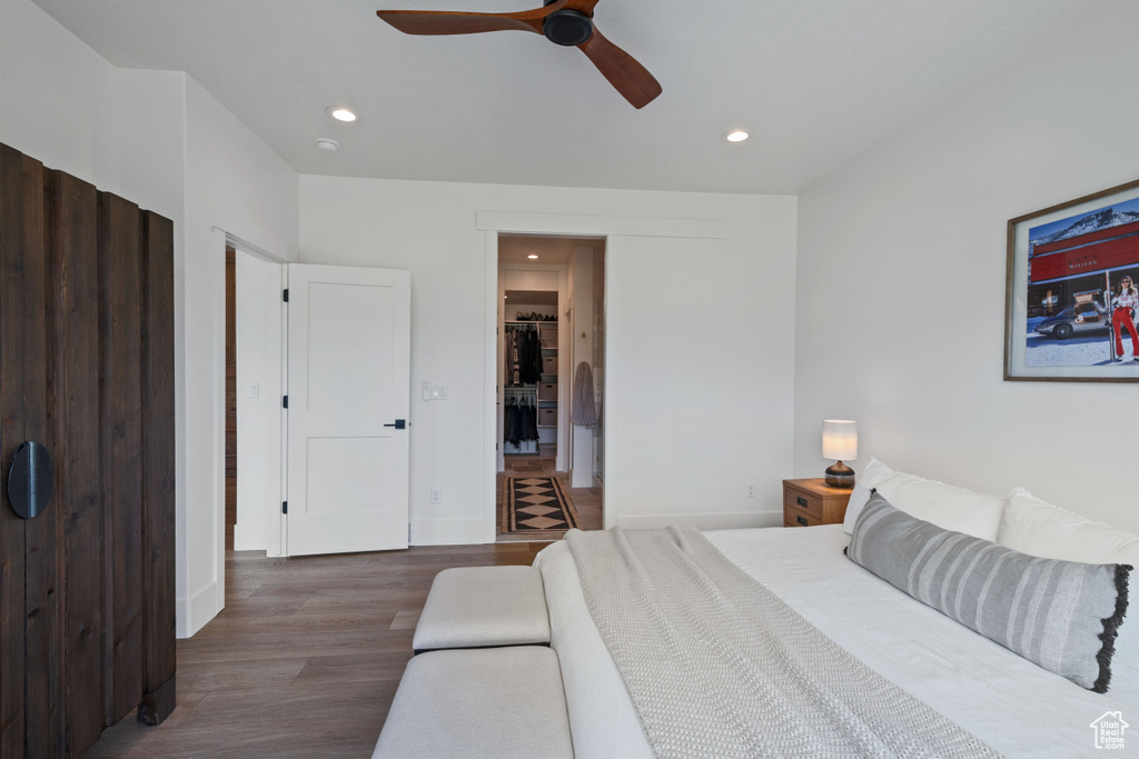 Bedroom featuring wood finished floors, recessed lighting, baseboards, and a ceiling fan