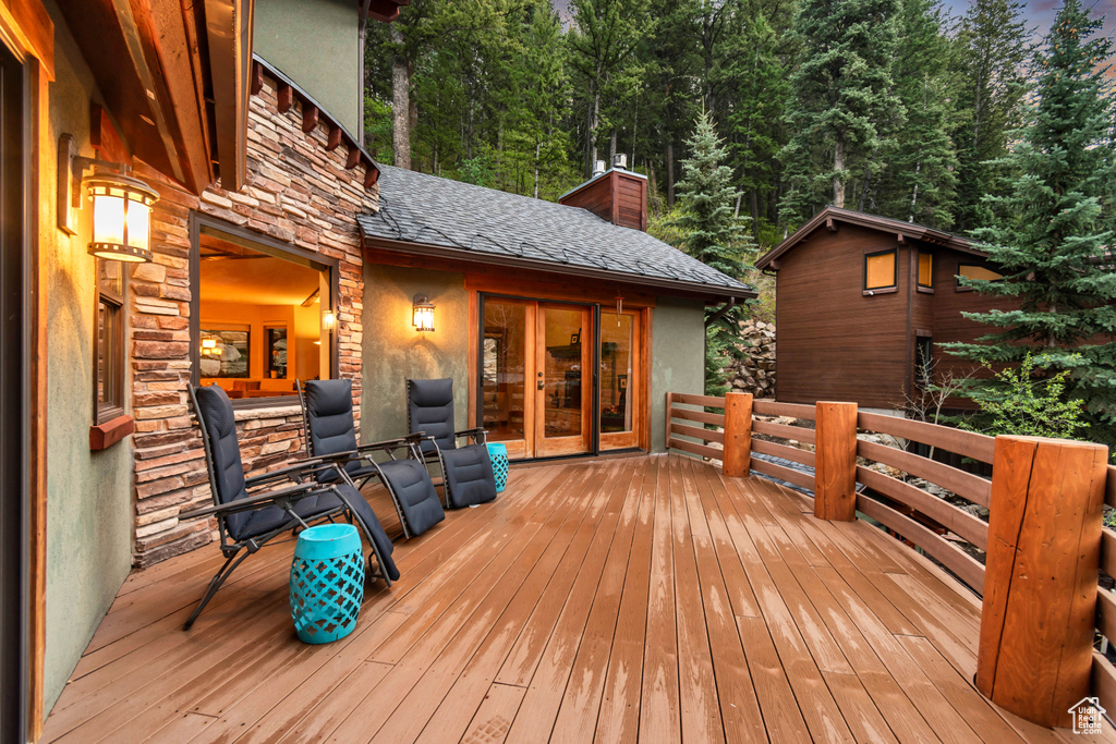 Wooden terrace featuring french doors