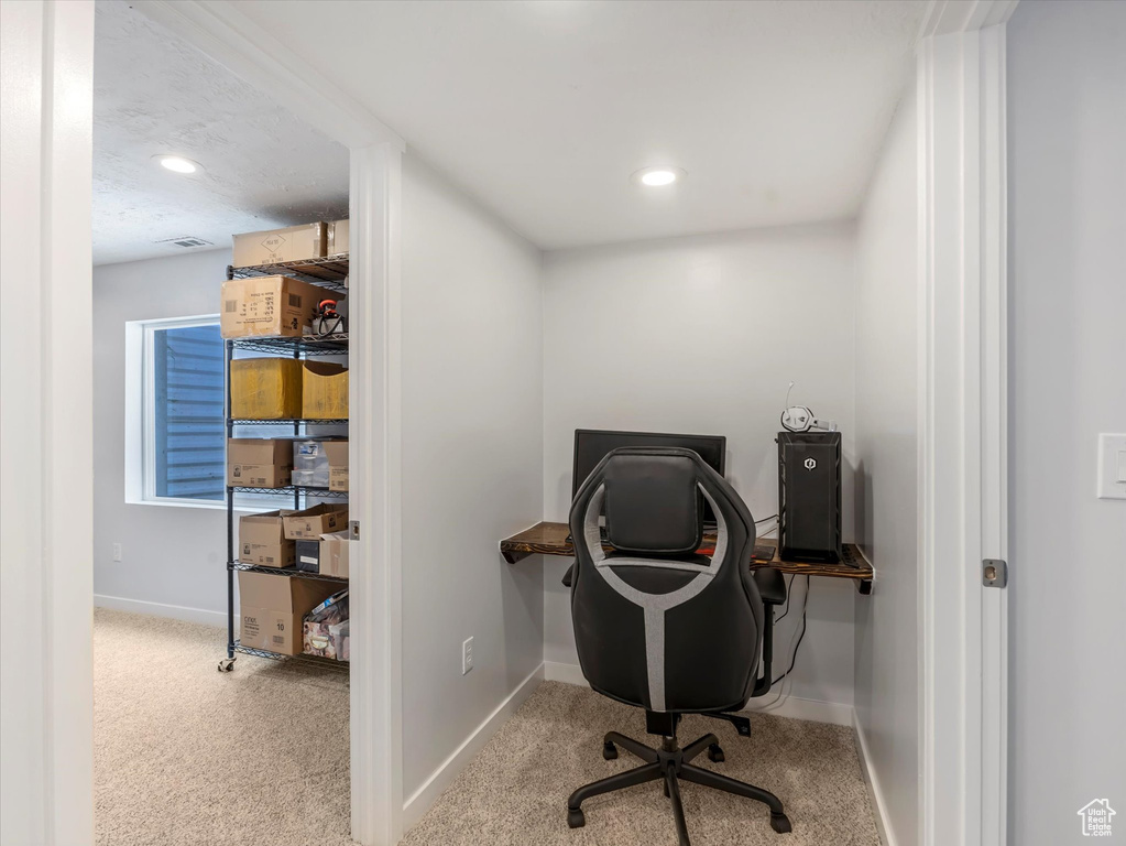 Carpeted home office featuring baseboards and recessed lighting