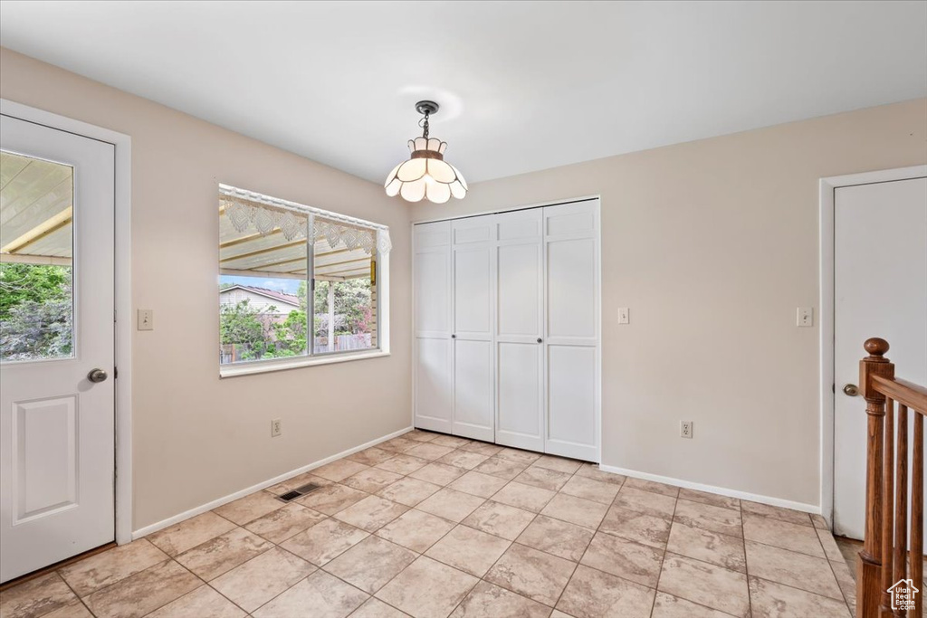 Unfurnished bedroom with baseboards and a closet
