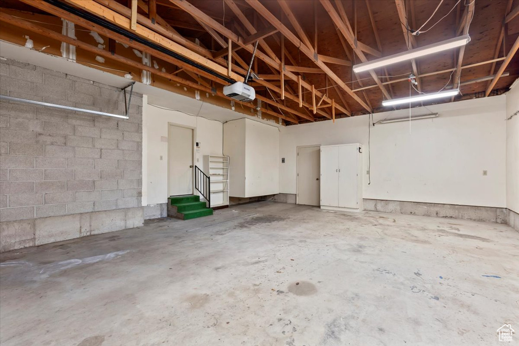 Garage featuring a garage door opener