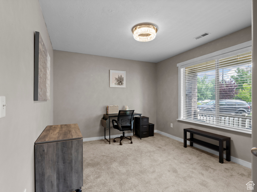 Office area with carpet floors and baseboards