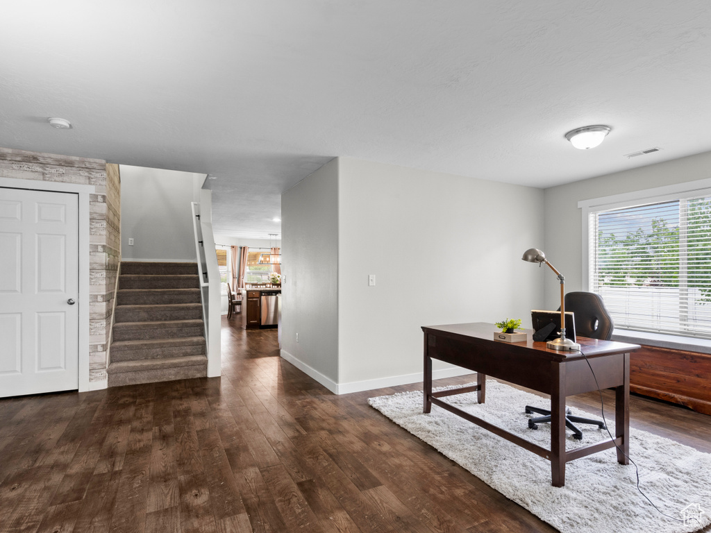 Office area featuring wood finished floors and baseboards