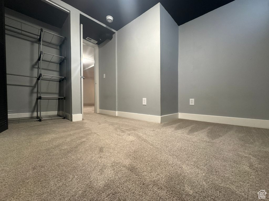 Below grade area with carpet and baseboards