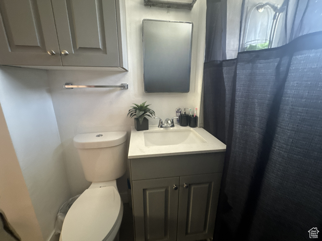 Bathroom featuring toilet and vanity