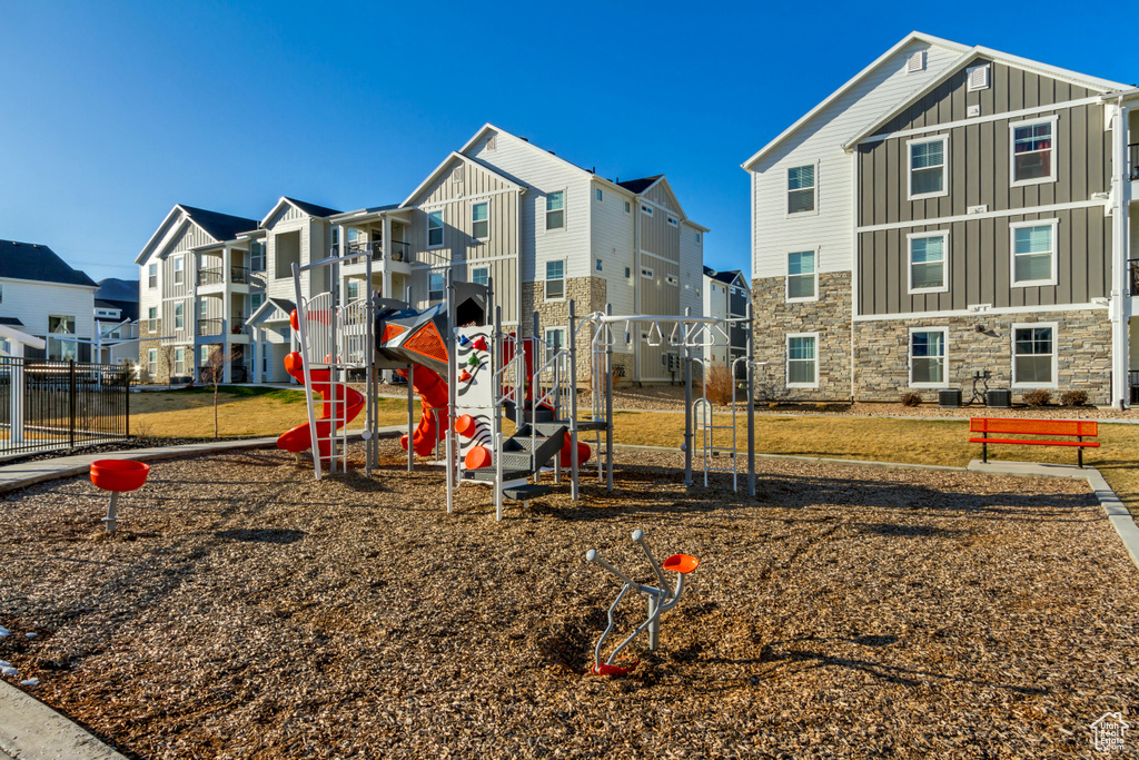 Community jungle gym with a residential view