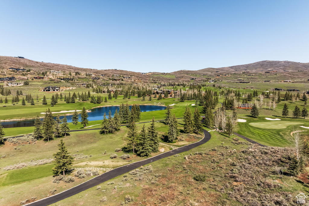 Bird\'s eye view of a water and mountain view and a golf club