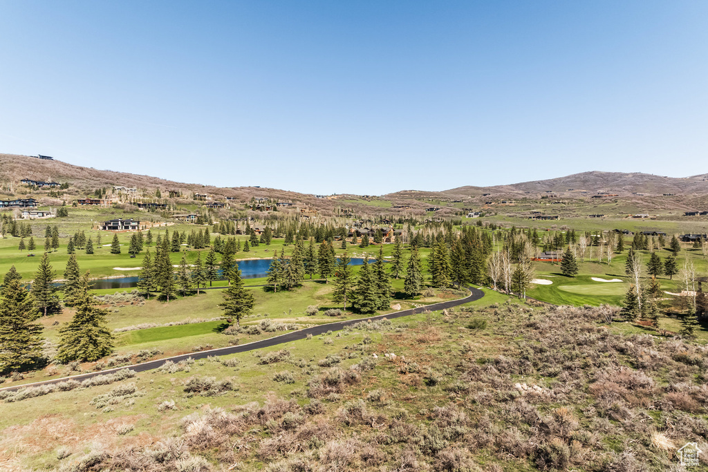 Mountain view with a nearby body of water and a golf course