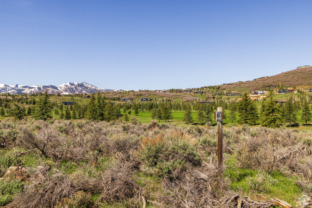 View of mountain background featuring rural landscape