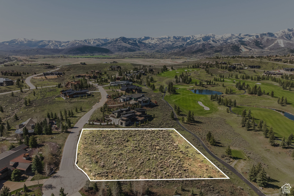 Aerial view of a water and mountain view and a golf course