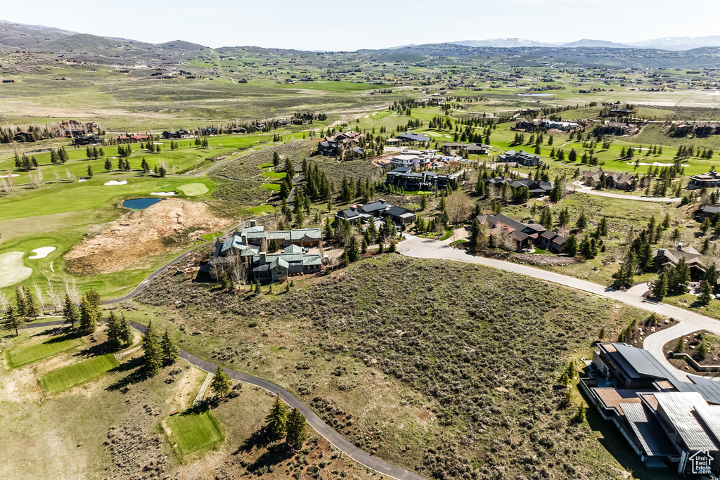 View of property location featuring a mountain backdrop and a golf club