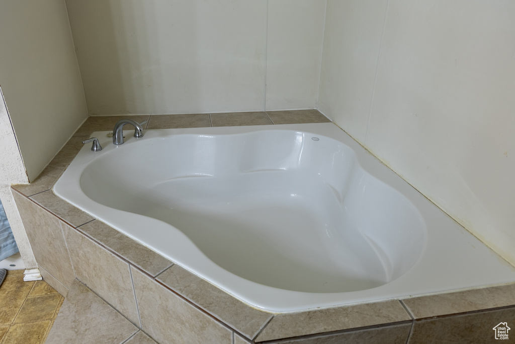 Full bathroom featuring a garden tub