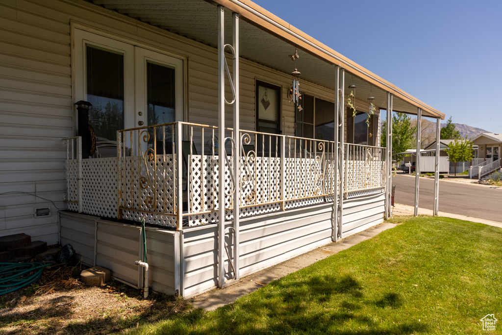 View of side of property with a yard