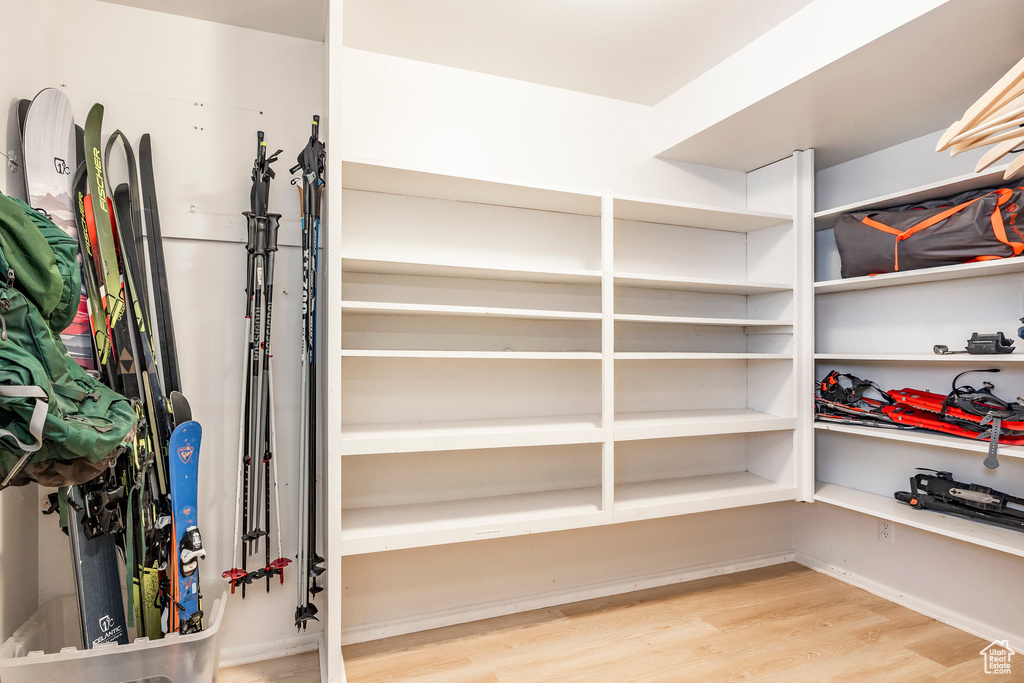 Spacious closet featuring wood finished floors