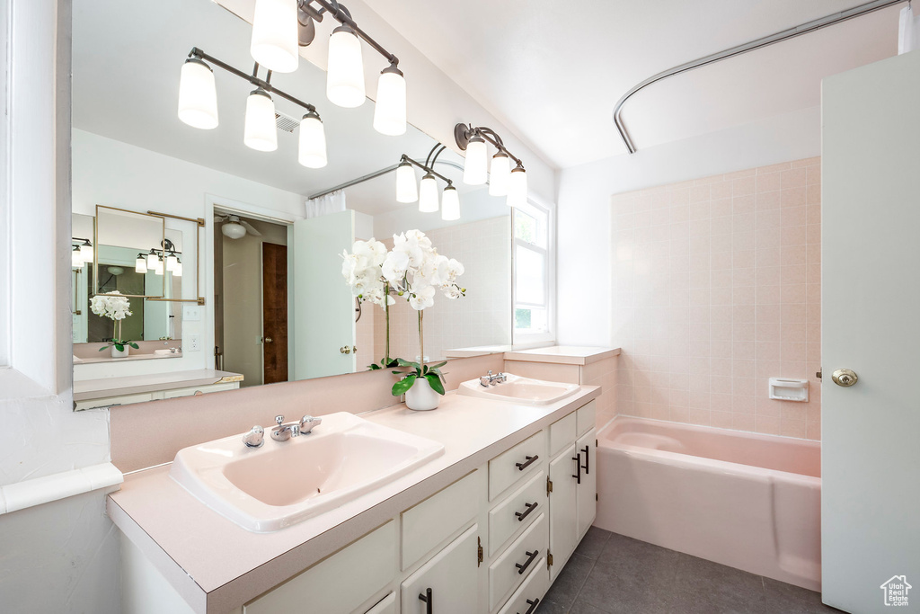 Full bath with tile patterned flooring and double vanity