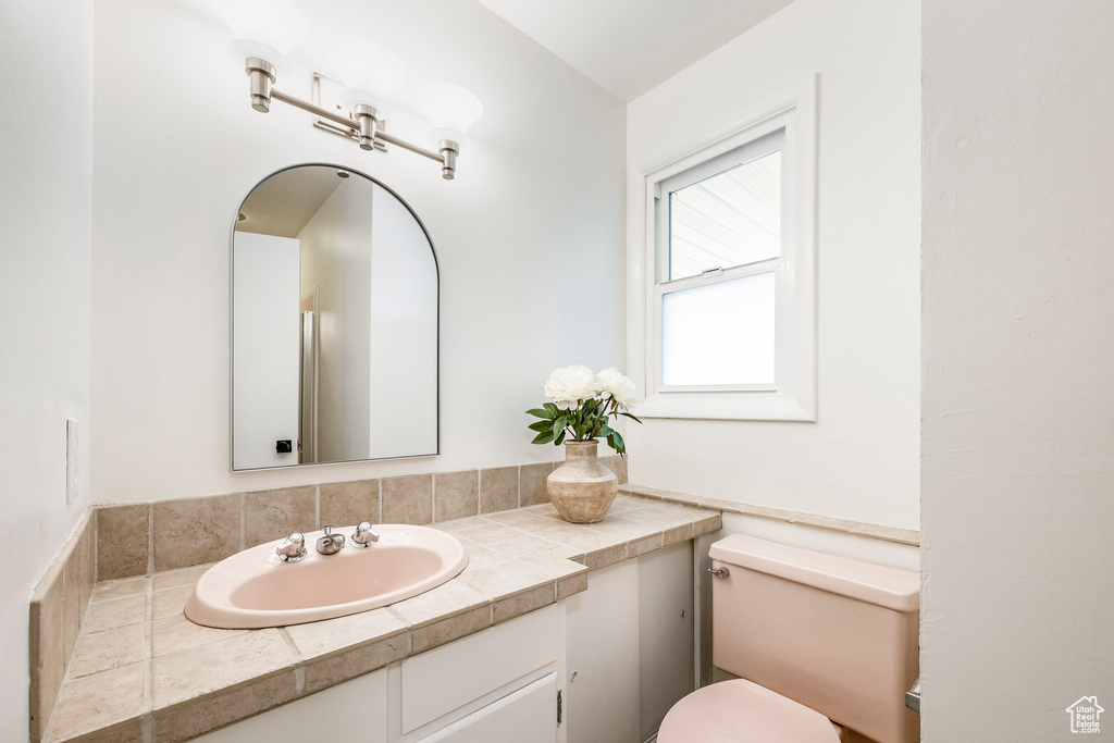 Bathroom featuring toilet and vanity