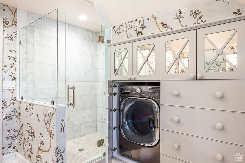 Washroom with washer / dryer and cabinet space
