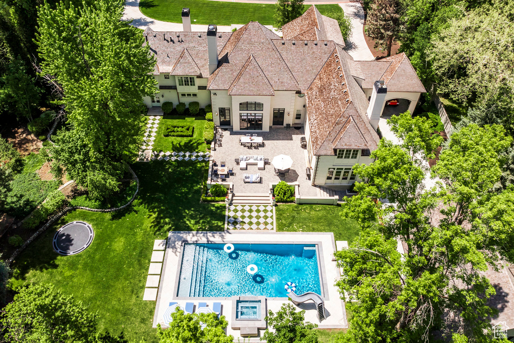 View of subject property featuring a pool area