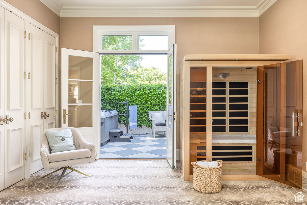 Entryway with crown molding and a sauna / steam room