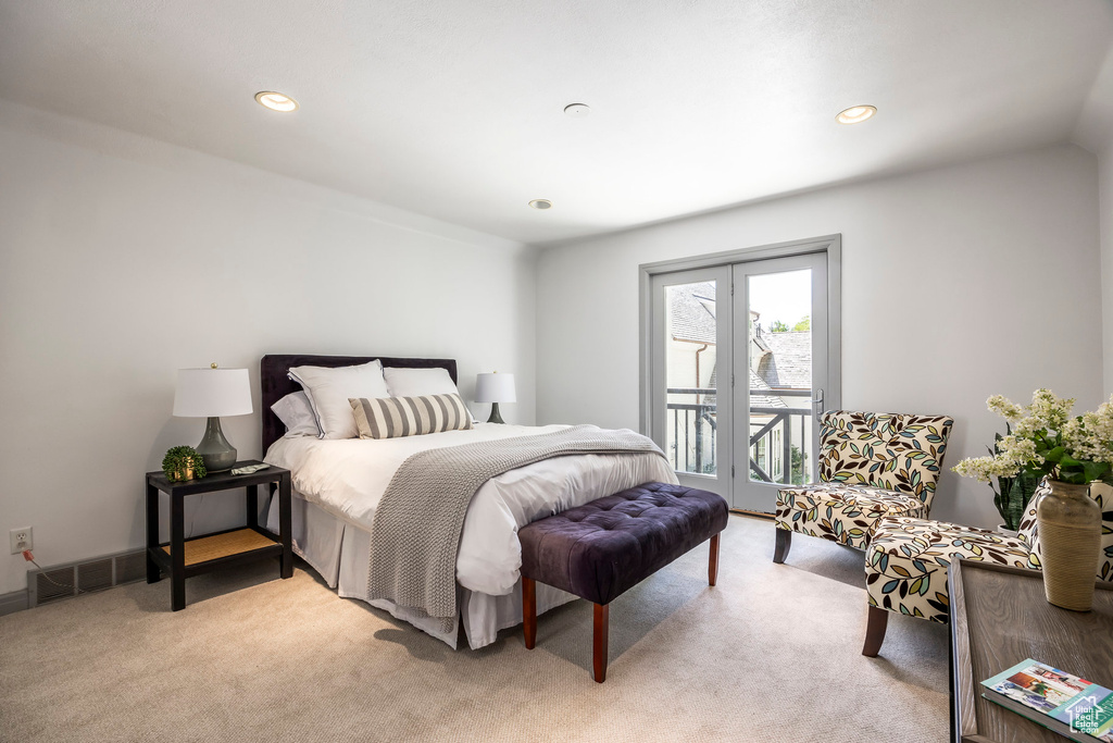 Bedroom featuring access to outside, light colored carpet, and recessed lighting