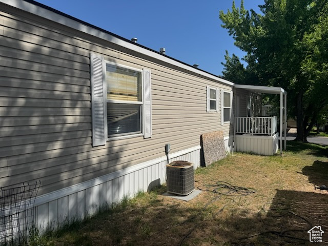 View of side of property featuring central AC unit