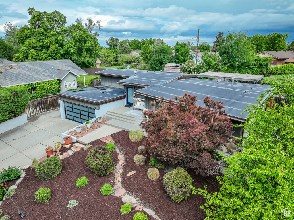 Back of house featuring concrete driveway