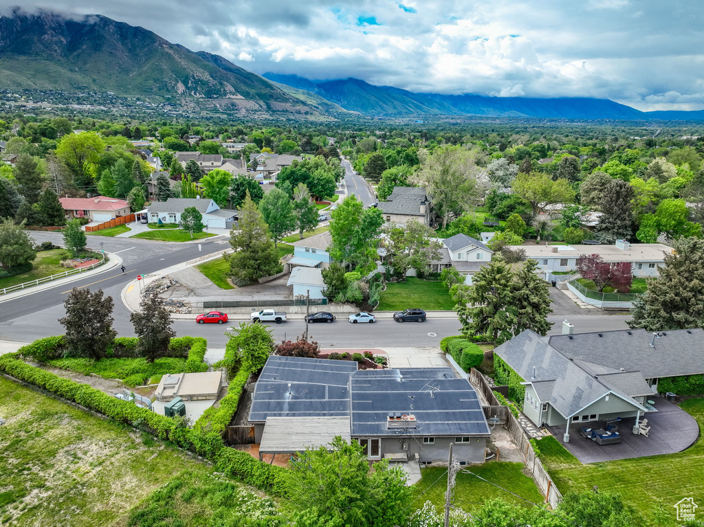 Aerial view of residential area featuring a mountainous background