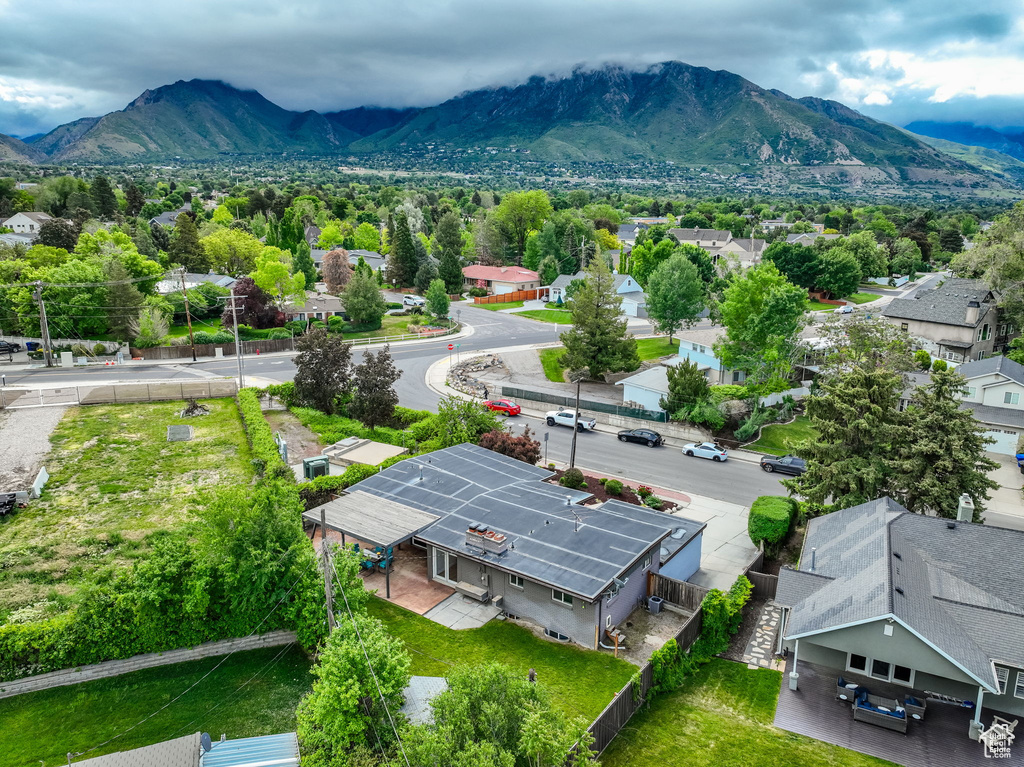 Aerial view of residential area featuring a mountain backdrop