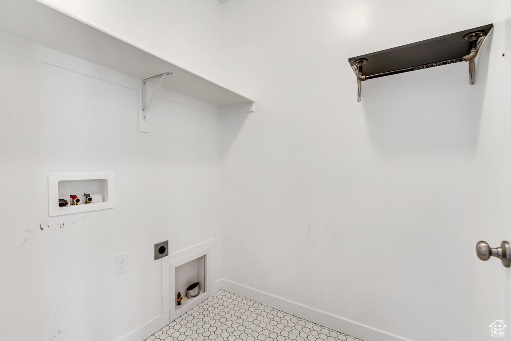 Laundry area featuring washer hookup, baseboards, hookup for an electric dryer, and light flooring