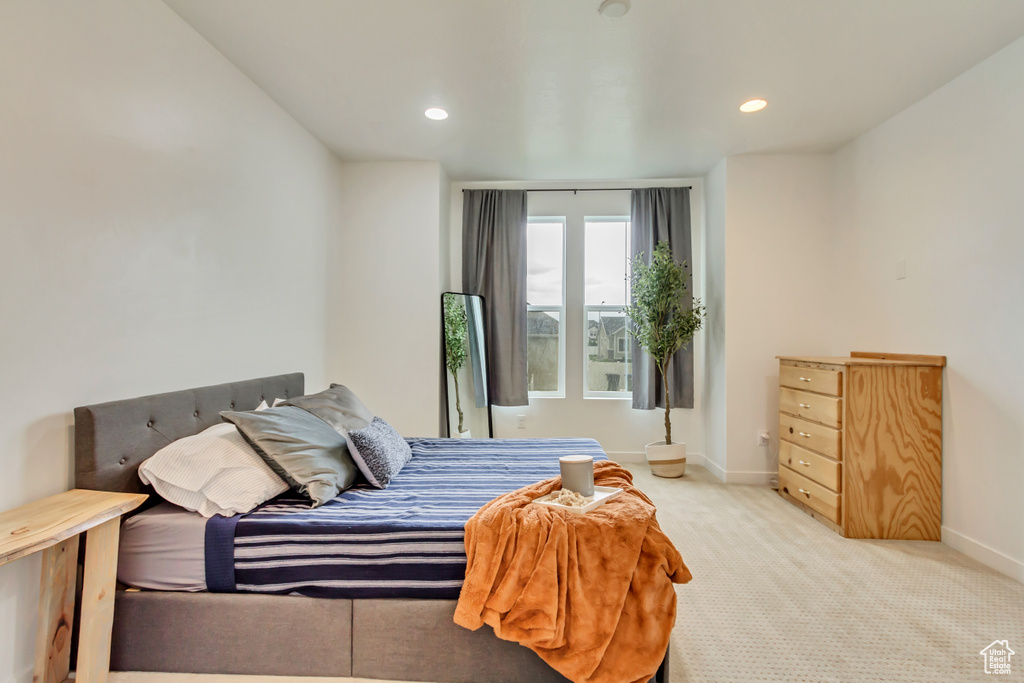 Bedroom featuring baseboards, carpet floors, and recessed lighting