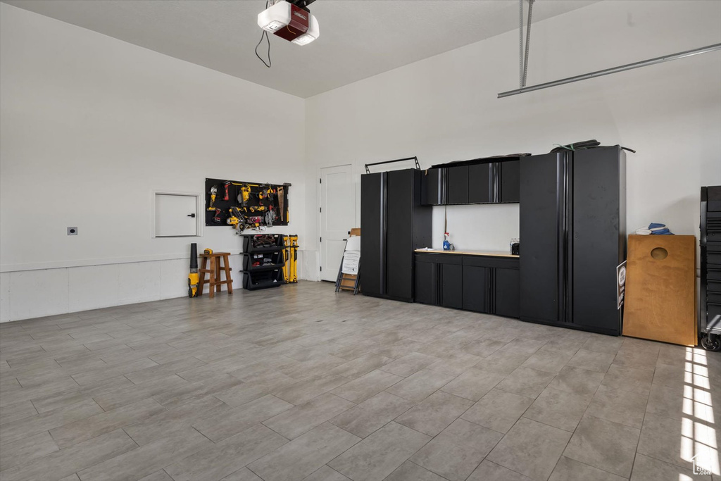 Garage featuring a garage door opener