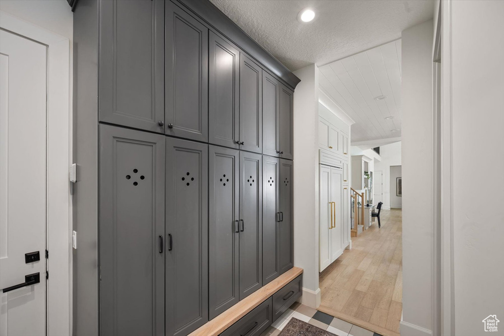 Mudroom featuring baseboards, recessed lighting, and light wood finished floors