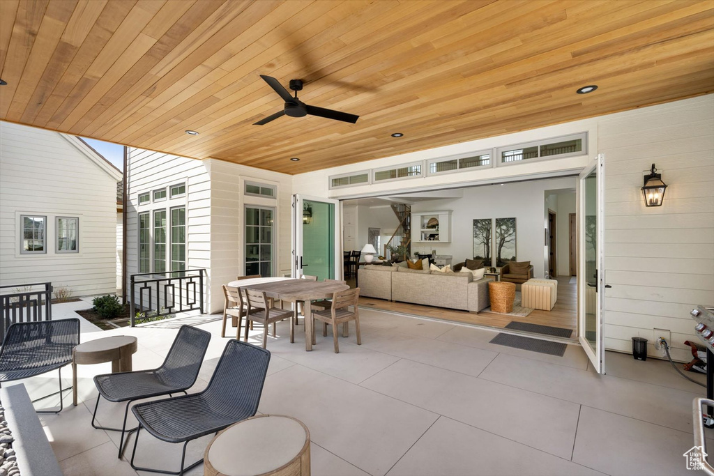 View of patio featuring an outdoor hangout area, outdoor dining area, and ceiling fan