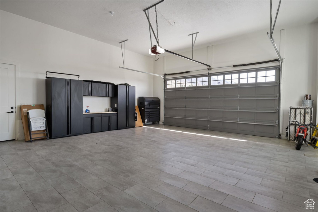 Garage featuring a garage door opener