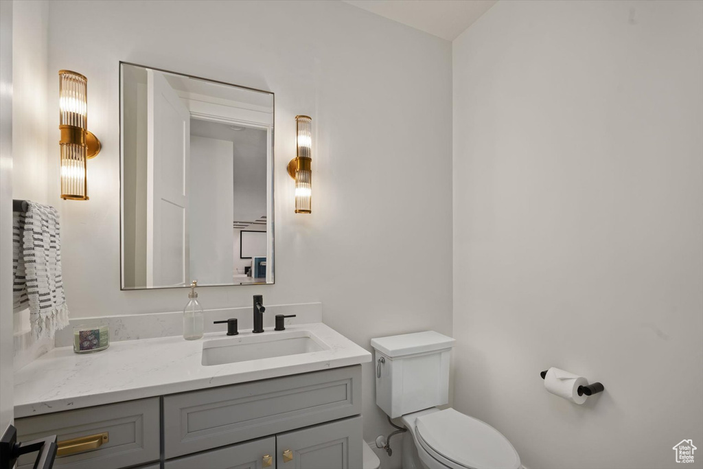 Bathroom with toilet and vanity