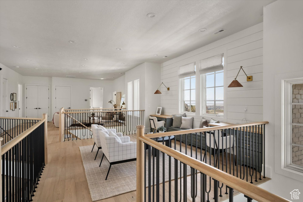 Living room featuring light wood-style floors and recessed lighting