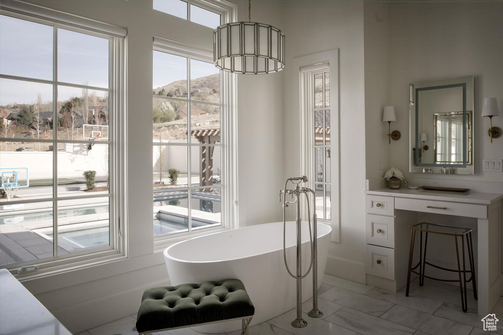 Dining space featuring light marble finish flooring