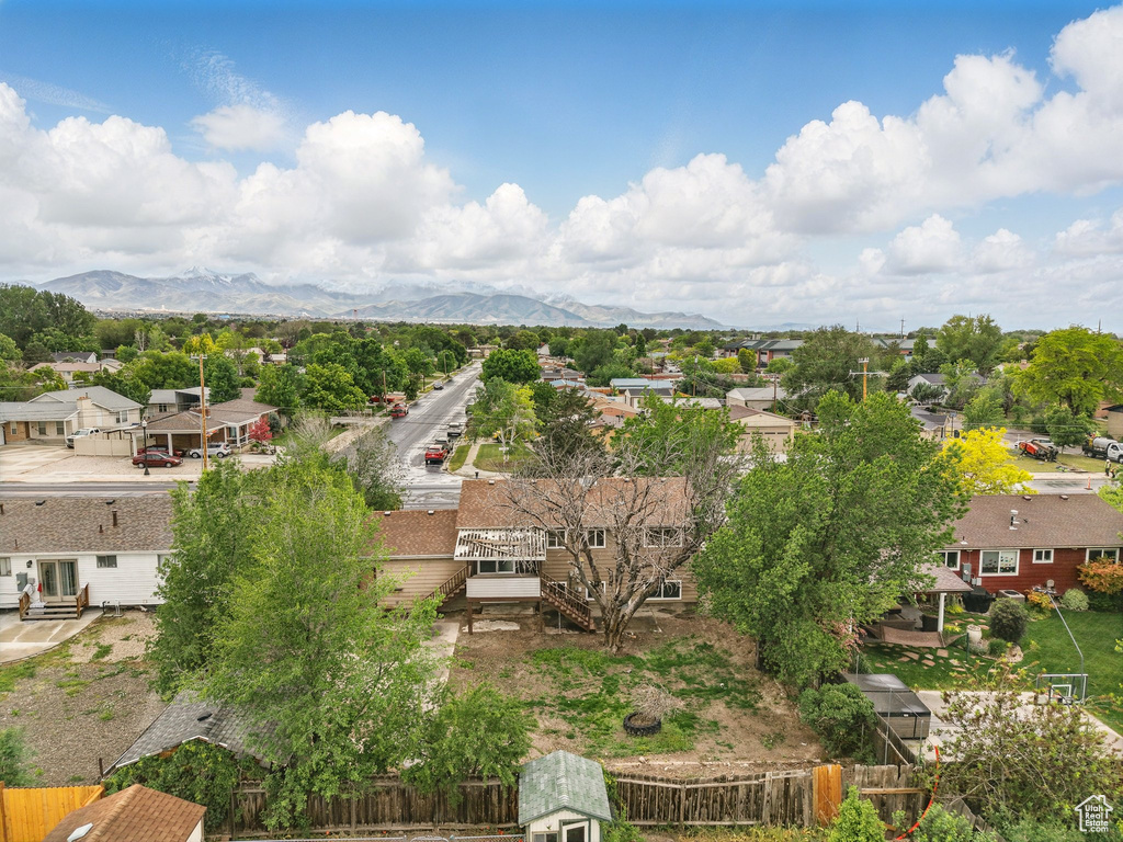 Aerial view of residential area featuring mountains