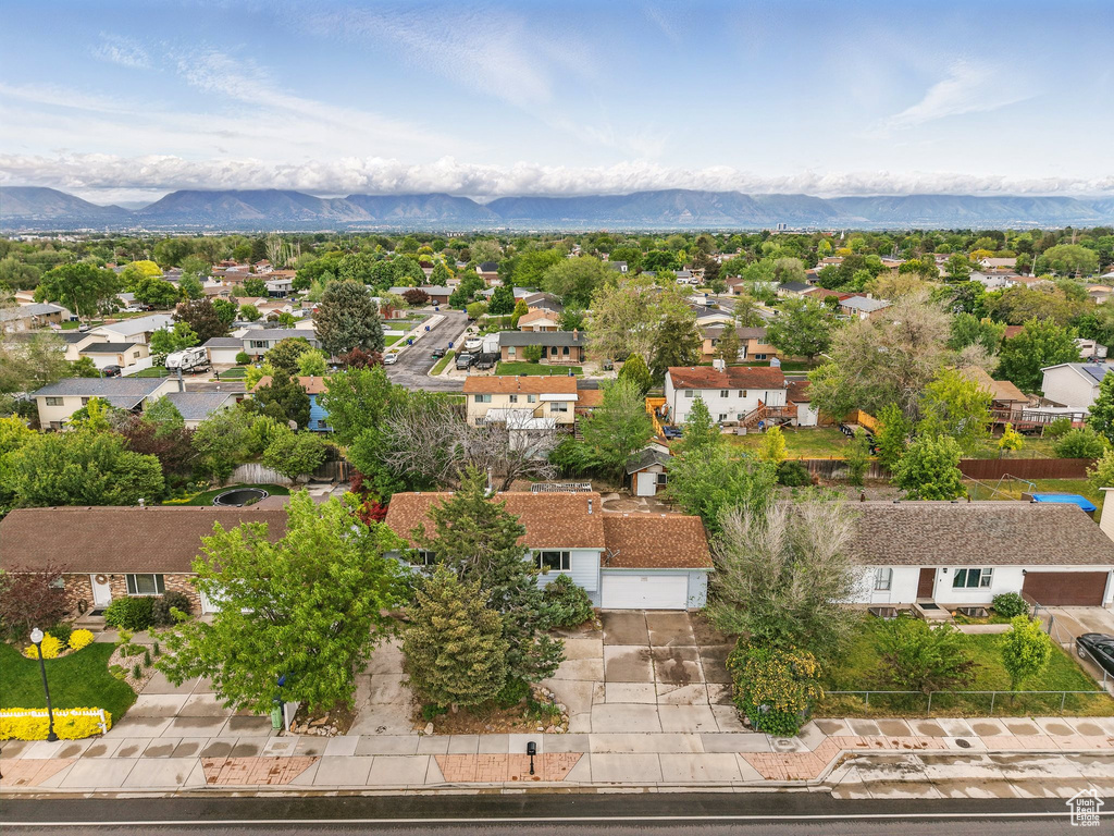 Aerial view of residential area featuring mountains