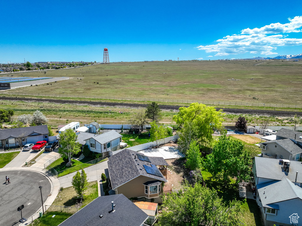 Aerial view of sparsely populated area with nearby suburban area