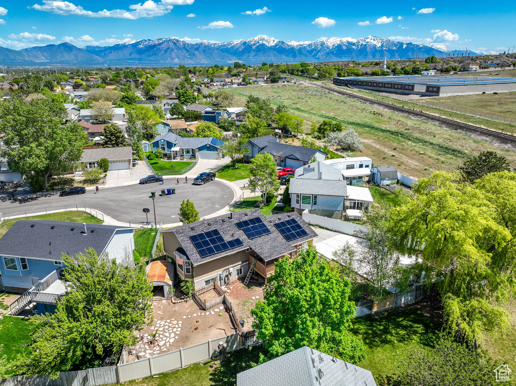 Aerial perspective of suburban area with a mountainous background