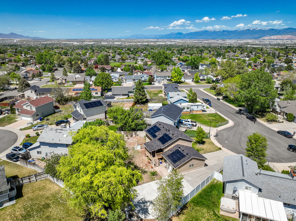 Aerial perspective of suburban area featuring a mountainous background