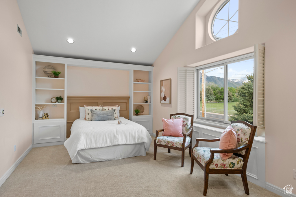 Bedroom with multiple windows, light colored carpet, high vaulted ceiling, baseboards, and recessed lighting