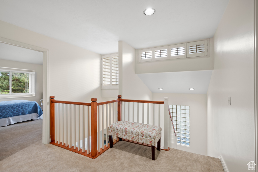 Hallway with carpet floors and recessed lighting
