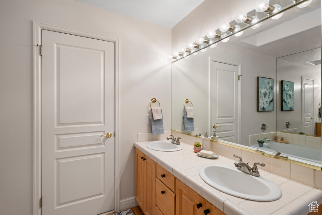Bathroom featuring double vanity