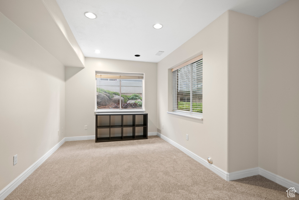Unfurnished room with carpet, baseboards, and recessed lighting