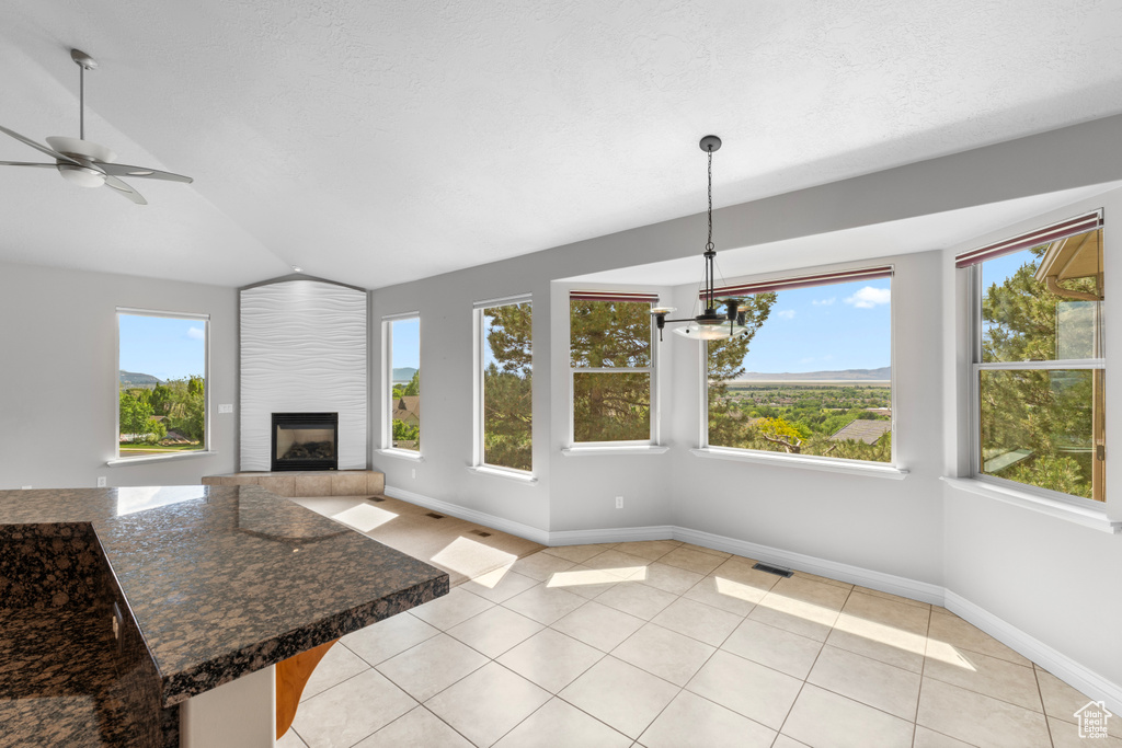 Unfurnished sunroom with vaulted ceiling