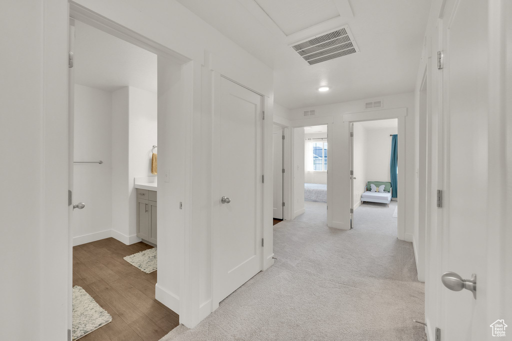 Hall featuring light wood-style floors