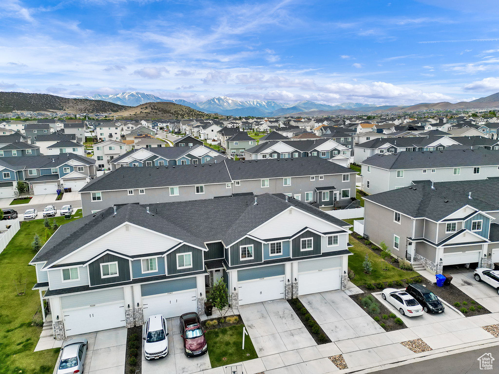 Aerial view of residential area featuring mountains